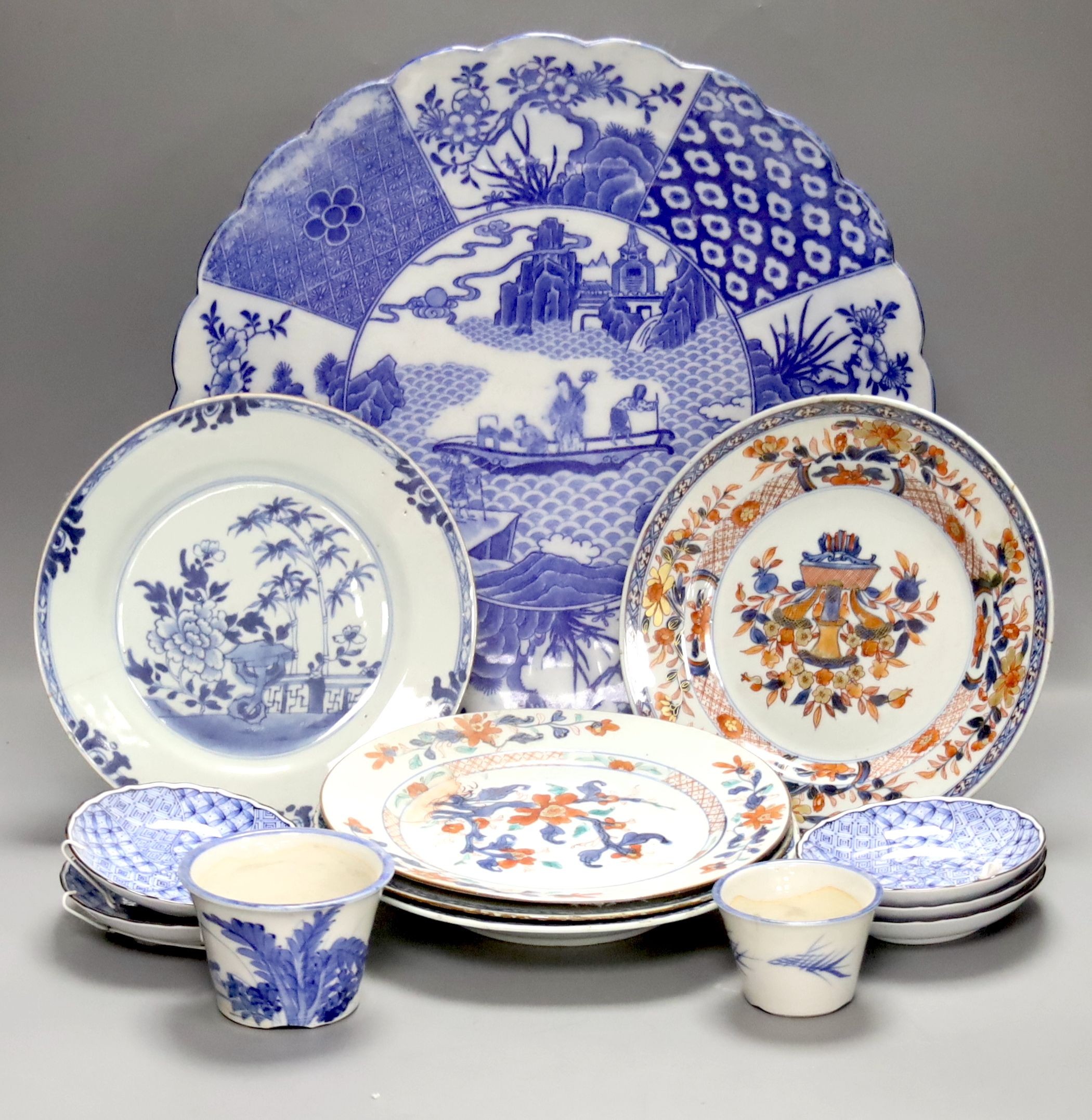 Two Chinese Imari dishes, three Chinese blue and white dishes, a larger Japanese blue and white dish, 5 Japanese blue and white saucer dishes and 2 miniature blue and white jardinieres. 40cm